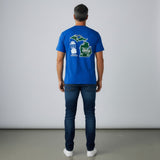 Man wearing a royal blue Old Coleman Parts t-shirt with a Michigan map and lantern graphic on the back